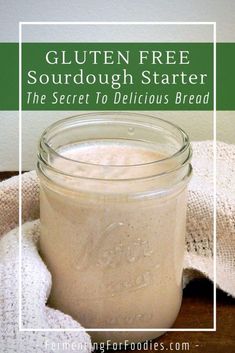 gluten free sourdough starter in a mason jar with a towel around it