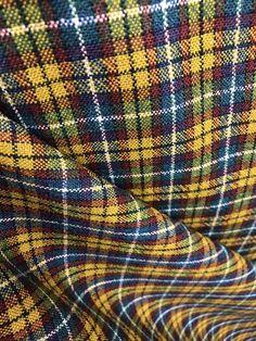 a close up shot of a plaid fabric