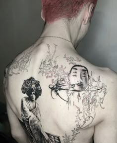 a man with red hair and tattoos on his back