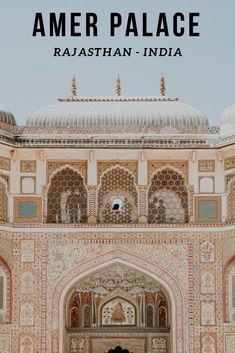 the bride and groom are standing in front of an ornate building