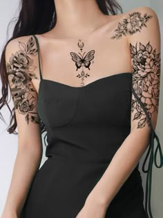 a woman with tattoos on her arm and shoulder is posing for the camera while wearing a black dress