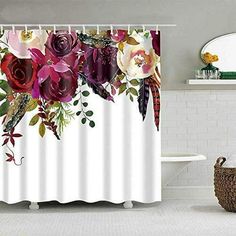 a shower curtain with flowers and feathers on it in a white bathroom, next to a bathtub