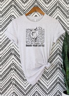 a women's t - shirt with three horses printed on the front and back