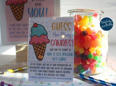 there is a jar full of gummy bears next to a sign that says guess how many candies are in it