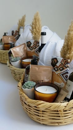 baskets filled with different types of items on top of a white table next to each other