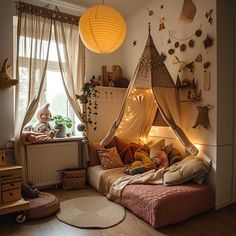 a bedroom with a bed and some lights on the wall next to a window in front of it