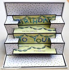 three folded birthday cards with the words happy birthday to you written in blue and green