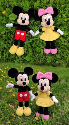 three crocheted mickey and minnie mouses are standing in the grass with their arms around each other