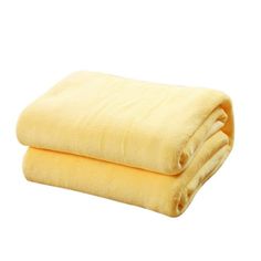 two yellow blankets folded on top of each other