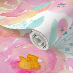 a pink and yellow floral wallpaper with watercolor flowers on it's surface