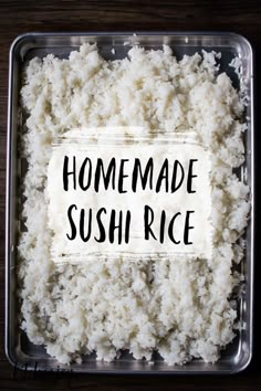 rice with the words homemade sushi rice written on it in black ink, sitting in a plastic container