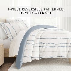 three piece reversible patterned duvet cover set in white and blue colors