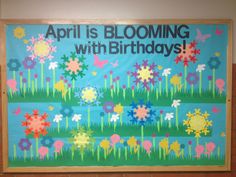 a bulletin board with flowers on it that says, april is blooming with birthdays