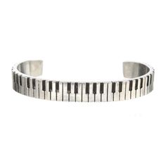 PRICES MAY VARY. PIANO CUFF PEWTER BRACELET - Wonderful gift for any musician! Also a great gift for a music or piano teacher! PERFECT FOR A MAN OR A WOMAN - Our pewter cuffs have a little "squeezability" to them to tighten them up slightly for a small wrist - and is perfect fit up to a medium sized men's wrist. ACCESSORIZING LIFE'S JOURNEY - Whitney Howard Designs creates pieces that are meant to be a lasting sentiment or meaningful cuffs that the owner will enjoy wearing for several years. PRO Guitar Ring, Piano Gifts, Music Teachers, Womens Cuff Bracelets, Music Teacher Gifts, Music Student, Piano Player, Universal Language, Piano Keys