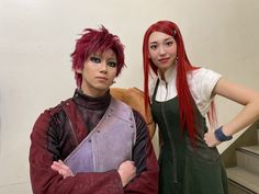 two people standing next to each other with red hair