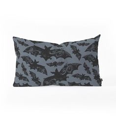 a black and grey pillow with bats on it