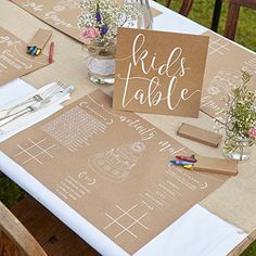 a table set up with place cards and napkins for guests to use on their wedding day