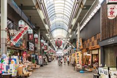 an indoor market with lots of items for sale