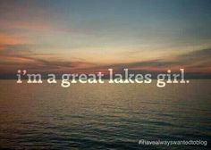 the words i'm a great lakes girl are in front of an ocean sunset