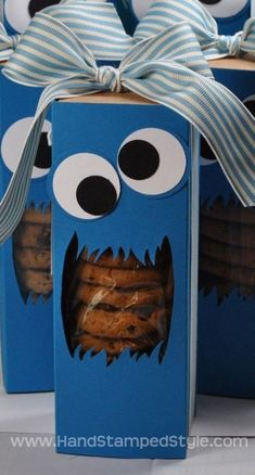 a blue box with some cookies in it and a monster face on the top of it