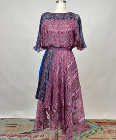 Special Vintage Silk Farm Designed by Icinoo Blouson Dress Purple Blue Intricate Detail. This near-perfect condition dress is a rare find without any holes and stains. The intricate print and metallic stitching flows beautifully on the body. It does not have a slip dress included for underneath, but we have many for sale.  Measurements are in inches-  Bust: 40" Waist: 30"-34" Hips: 52" Length: 48" Sleeve length: 14" Yes, we refund international shipping overcharges when we generate the shipping label! Please do not message us about changing customs descriptions. We are legally bound to declare what is in the package.  All boxes and props pictured are NOT included in purchase. Blouson Dress, Farm Design, 1970s Fashion, Vintage Silk, Modern Fashion, Purple Dress, Dress Clothes For Women, Blue And Purple, Slip Dress