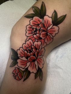 a woman's thigh with flowers on it