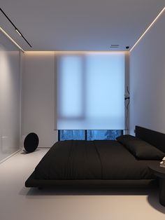 a modern bedroom with black and white decor