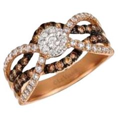 a diamond ring with brown and white diamonds