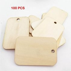 small wooden tags with holes on them