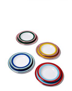 four colorful plates sitting on top of each other