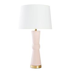 a pink table lamp with a white shade