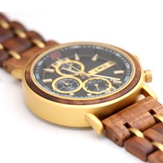 Sunrise - Hawaiian Koa Wood and Steel Watch The Sunrise Watch is a stylish timepiece that combines the warmth and beauty of Hawaiian Koa wood with matte gold-tone steel accents. The sun-colored gold-tone watch case features a black watch face, highlighted by gold and white numbering and a koa wood bezel. Its precision time-keeping ensures accuracy, while a Hawaiian Koa link and gold bracelet complete the look. Experience quality craftsmanship with this statement accessory. Description: Quartz mo Watch The Sunrise, Apple Watch バンド, Wood And Steel, Koa Wood, The Sunrise, Watch Faces, Steel Watch, Watch Case, Black Watch