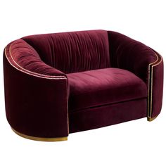 a purple velvet chair with gold trimmings on the arm and back, sitting in front of a white background