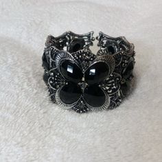 Pretty Metal Cuff Bracelet With Butterfly Design Measures 1 1/2" Wide At The Widest Part. Very Sparkly And Elegant To Go With A Variety Of Outfits. Adjustable Black Nickel-free Cuff Bracelet, Silver Stretch Bangle Bracelet For Party, Nickel-free Black Bracelets For Party, Nickel-free Black Bracelet For Party, Party Black Nickel-free Bracelets, Adjustable Black Metal Stretch Bracelet, Black Metal Cuff Bracelet As Gift, Nickel Free Black Bangle Jewelry, Black Metal Cuff Bracelet For Gift