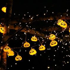 the lights are decorated with jack o lantern faces