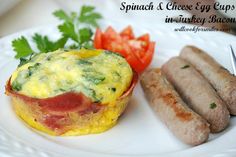 an omelet and sausage on a white plate