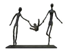 a statue of two people holding hands with a small child in the air above them