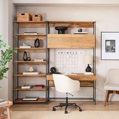 a room with a chair, desk and shelving unit in the corner next to a potted plant