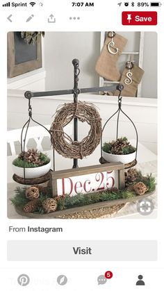 an image of a scale with wreaths and pine cones on it, which reads dec 25 from instagram visit