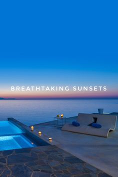 an outdoor swimming pool with candles on the ground and water in the background that reads breathtaking sunsets