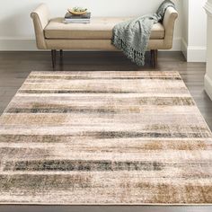 an area rug is shown in front of a couch