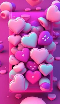 some pink and purple hearts are in the shape of heart shapes on top of each other