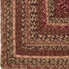 a red and green area rug with squares on the bottom, two rows of different colors