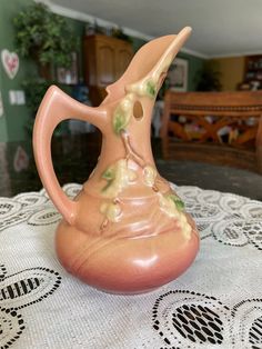 a ceramic vase sitting on top of a table