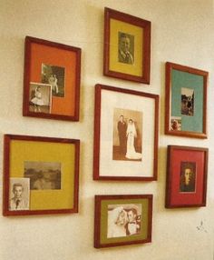 a wall with many different frames on it