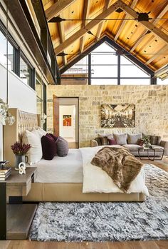 a large bed sitting inside of a bedroom on top of a wooden floor