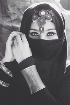 The Black Abaya covers the hair, and veils the face. This is a customary practice in the Middle East that is said to protect upper class women from male glances Arabic Makeup, Niqab Fashion, Arabian Women, Hijab Niqab, Arab Beauty, Arabian Beauty, Hijabi Girl, Arabian Nights, Muslim Girls