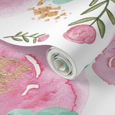 pink and green floral wallpaper with gold foiling on it's edges, next to a roll of toilet paper