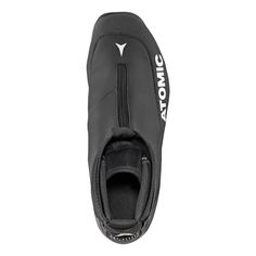 the bottom view of a black shoe with white lettering and an open zipper on it