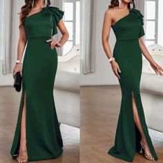 a woman in a green dress with one side slited and the other side split open